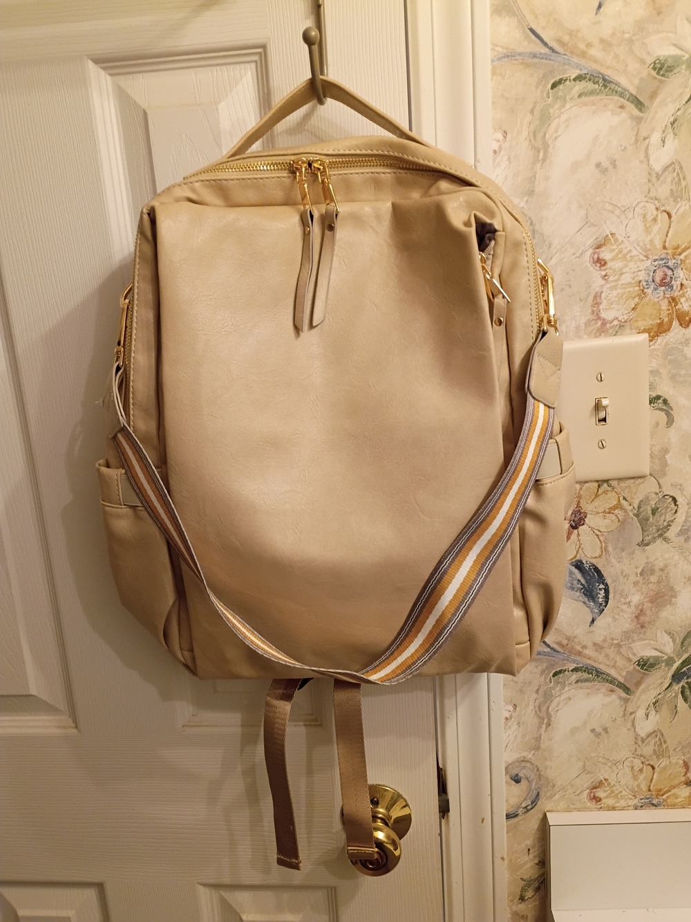 Beige Backpack with Striped Shoulder Strap